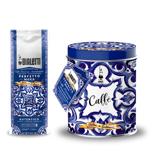 La Bialetti coffee packaging including a can and a bag with decorative blue and white design.
